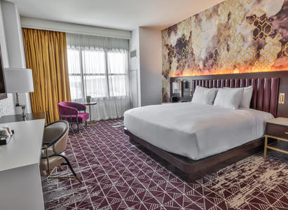 A hotel room with a bed in the new resort tower