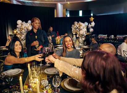 A group of people clinking wine glasses.